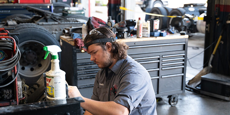 Service employee installing reflectors