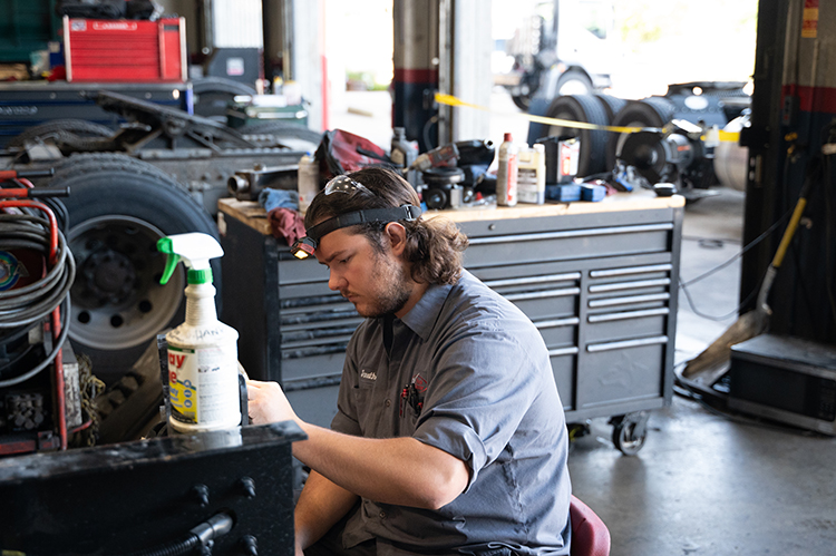 Service employee installing reflectors